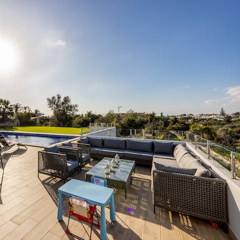 Gather on the outdoor sofas for pre-dinner drinks with loved ones