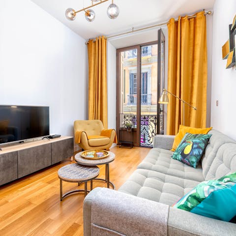 Read a book on the sofa by the window as you listen to the buzz of the city below