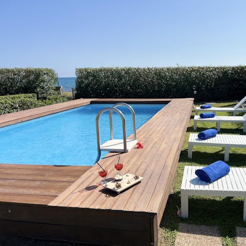 Take a dip in the pool, or head straight to the beach beyond