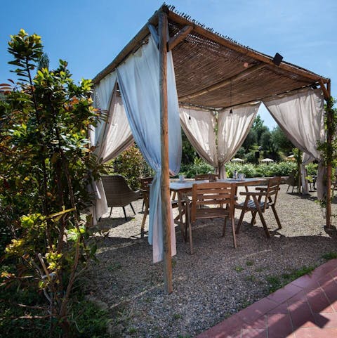 Relax with a good book underneath the various dining gazebos scattered around the grounds