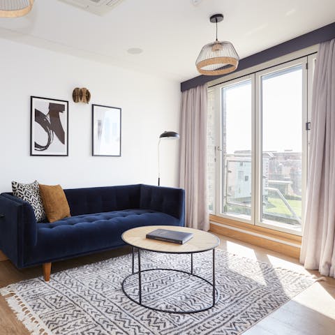 Step out onto the living room's balcony with your morning coffee