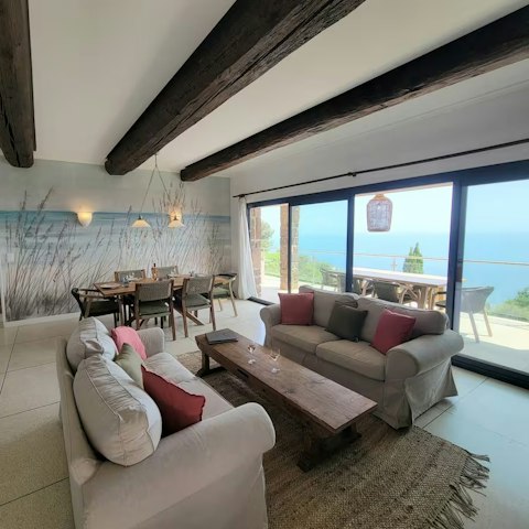 Unwind in the open-plan living space overlooking the sea