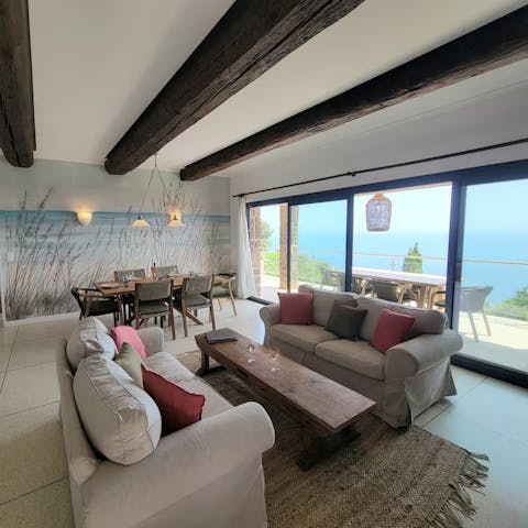 Unwind in the open-plan living space overlooking the sea