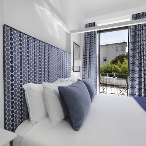 Snuggle up under the crisp, white sheets after a busy day spent exploring