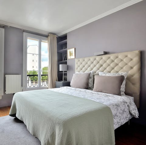 Wake refreshed in the serene bedroom, ready for a day of sightseeing