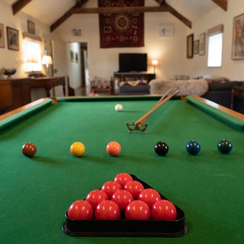Get a fierce rivalry going with another guest on the snooker table