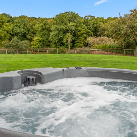 Catch the sun setting behind the horizon from the comfort of the hot tub