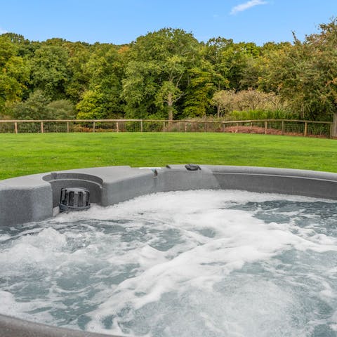 Catch the sun setting behind the horizon from the comfort of the hot tub