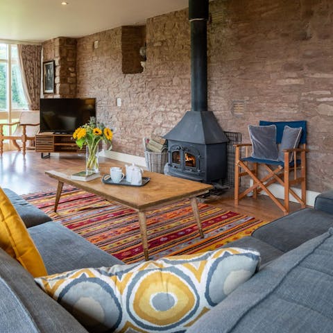 Put some logs into the wood-burner after returning from a bracing ramble
