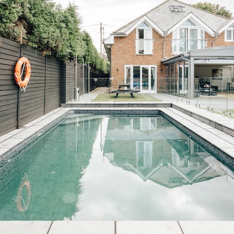 Enjoy an early morning swim in the home's private outdoor pool