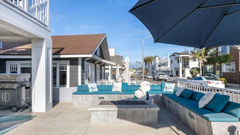 Gather outside around the firepit to unwind after a busy beach day