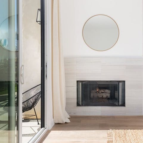 Get cosy by the master bedroom's fireplace
