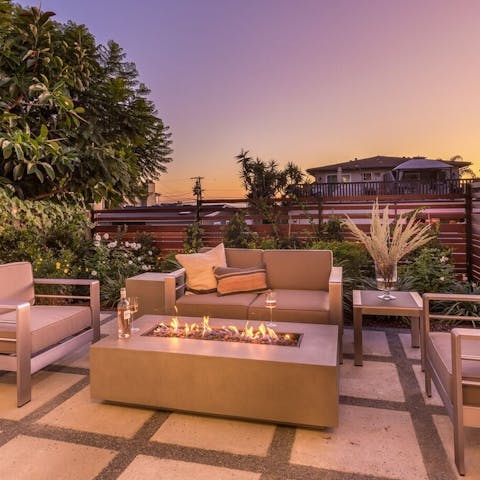 Entertain by the firepit in the tropical garden
