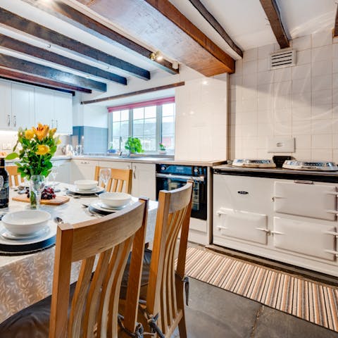 Cook something tasty in the Aga and serve to your loved ones in the rustic kitchen