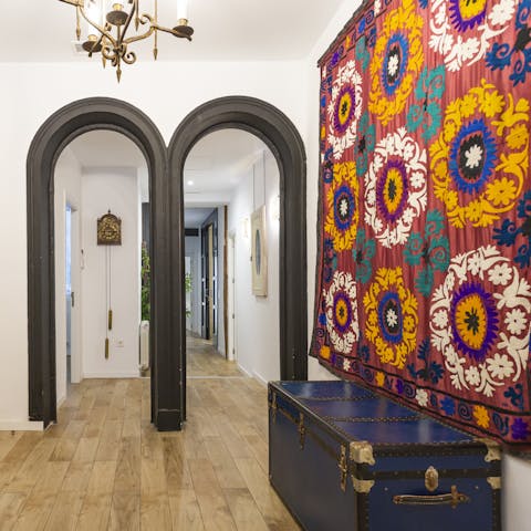 Admire original hanging artwork and vintage furnishings throughout the home
