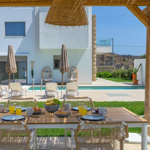 Enjoy outdoor meals under the shade of the pergola