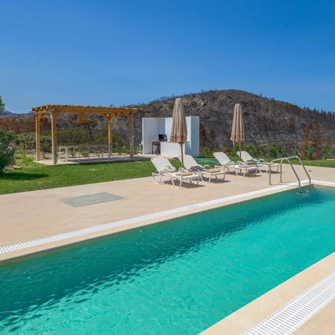 Swim in the private pool, with a view of the mountains