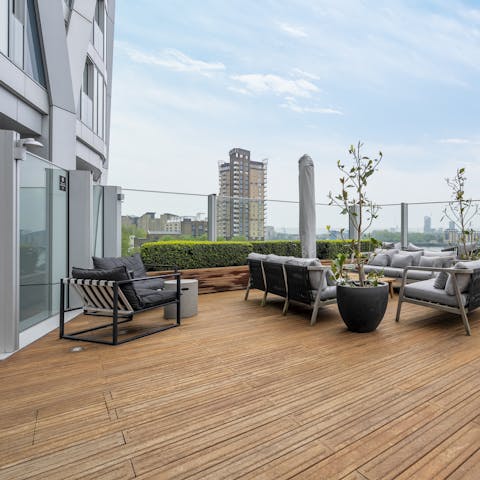 Take a seat on the communal roof terrace and enjoy a gin and tonic