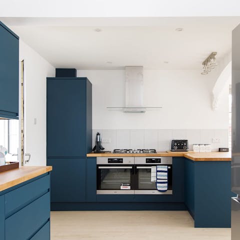 Flex your culinary skills in the made-for-action kitchen complete with dual ovens