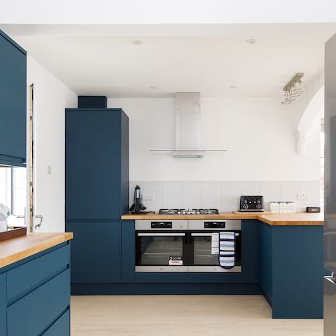 Flex your culinary skills in the made-for-action kitchen complete with dual ovens