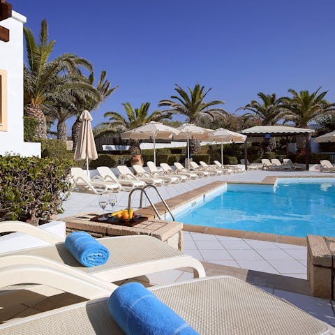 Lounge by the pool and take refreshing dips in its glistening waters