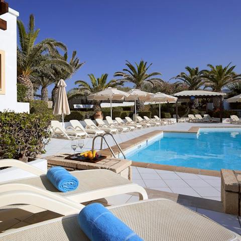 Lounge by the pool and take refreshing dips in its glistening waters