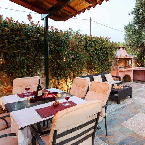 Gather for sunset drinks and Grecian inspired meals in the garden