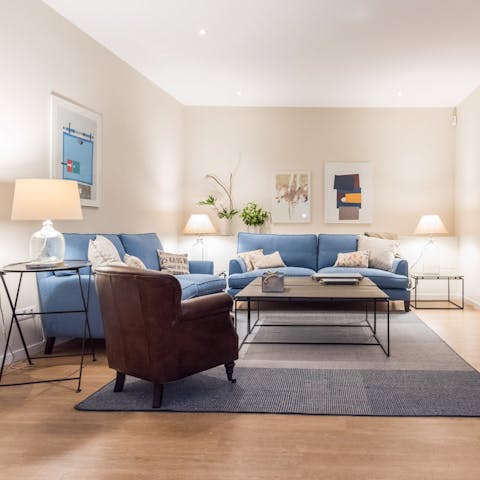 Lounge on the soft blue sofas after a long day on your feet