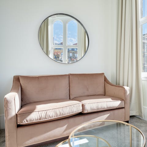 Relax on the plump sofa with your morning coffee while admiring Kensington views