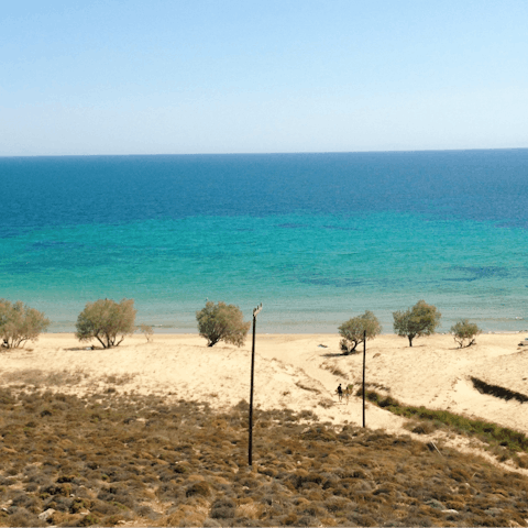 Lie back and relax on Naxos' sandy beaches, just a five-minute drive from your villa