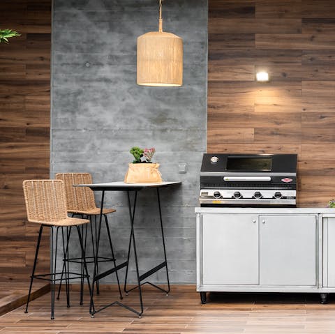 Grill up a storm in the stylish outdoor kitchen