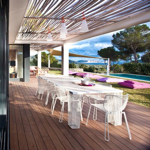 Enjoy a spot of alfresco dining on the covered patio area