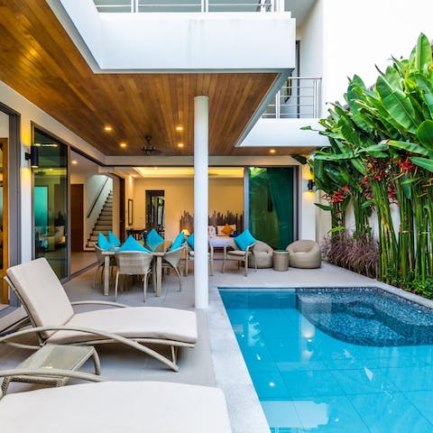 Lounge by the pool and admire your secluded tropical paradise