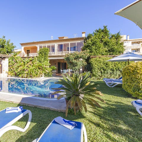 Soak up the sunshine at any hour of the day in this mature garden with a private pool