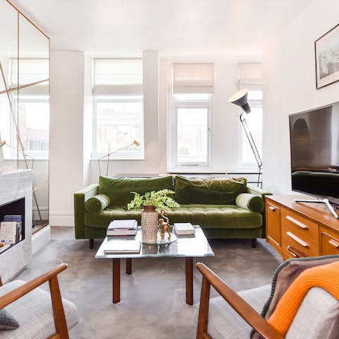 Relax in the bright living area with a glass of wine after a day of exploring