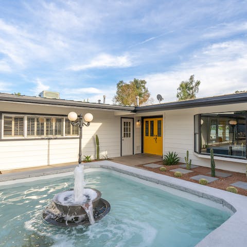Admire the water feature outside your front door