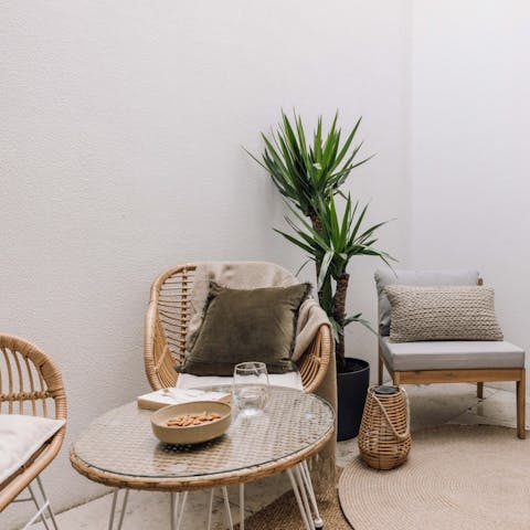 Sit out on the private terrace with a cold glass of ginjinha
