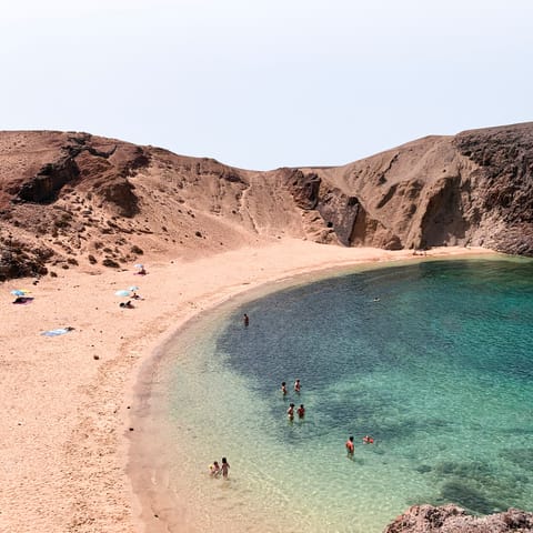 Head to Playa de Papagayo – less than a fifteen-minute walk away