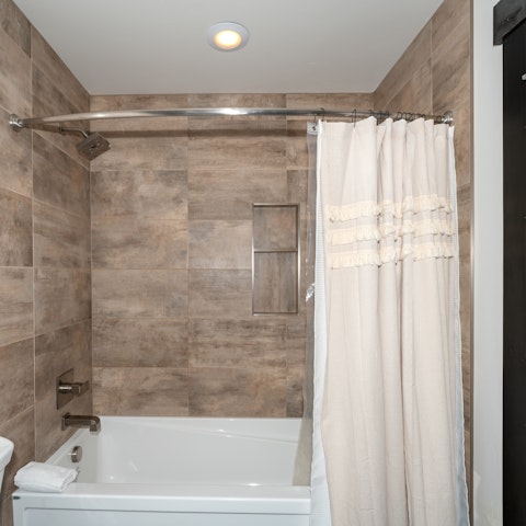 Unwind in the bathtub after a day outdoors