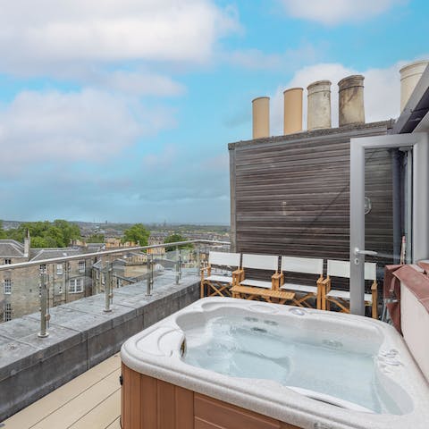 Admire the sweeping views of the Scottish capital from the comfort of the hot tub