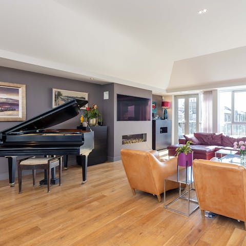 Take up residence on one of the pair of pianos and serenade guests