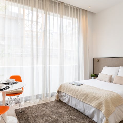 Enjoy a light-filled living space courtesy of floor-to-ceiling windows