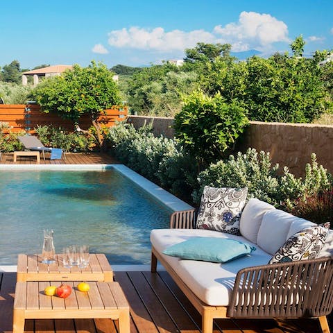 Take a chilled glass of Cretan wine out to the wooden decking in the afternoon