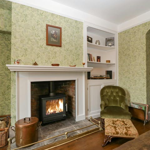 Warm up in front of the characterful fireplace