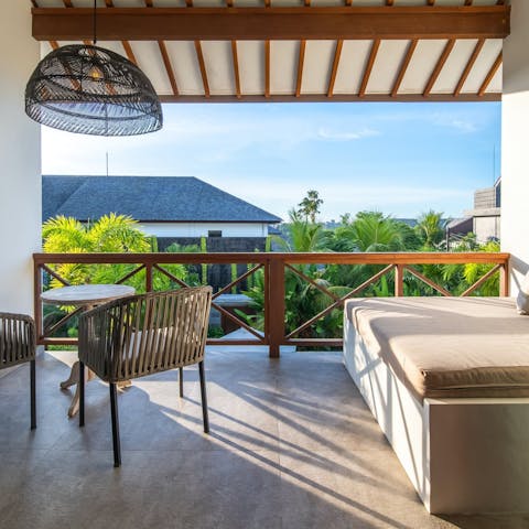 Enjoy a morning coffee or evening cocktail on the balcony
