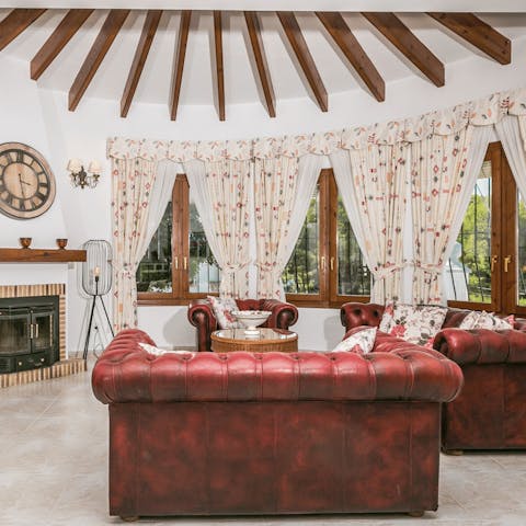 Wind down from your explorations in the cosy living area, a glass of wine in hand