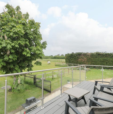 Admire the views from the bedroom's balcony