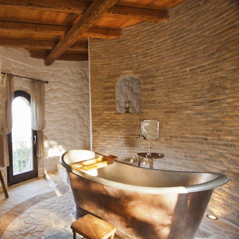Soak in the deep ancient bath tub