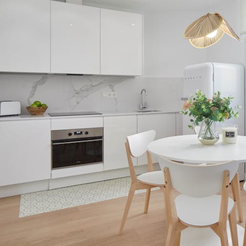 Whip up a quick bite in the compact and sleek kitchen