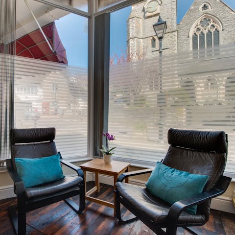 Bask in the lounge with the glorious sight of the stone church